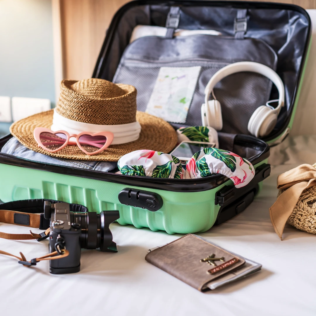 Suitcase with vacation items.